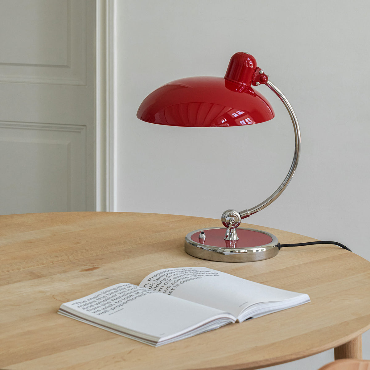 Birken Table Lamp in Red - On a Round Wooden Table