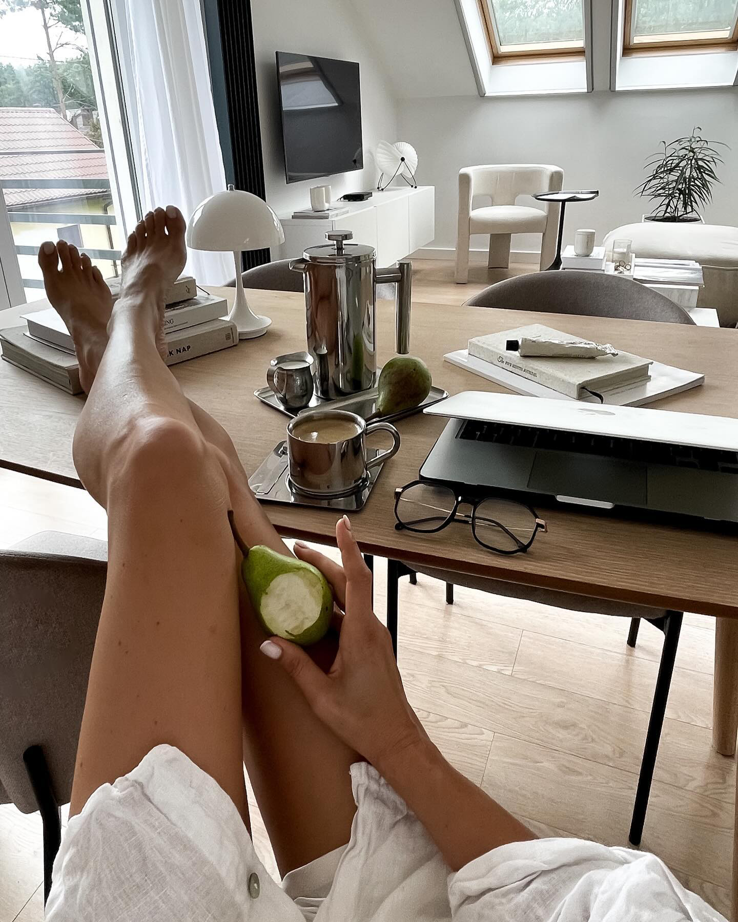 Estada Portable Lamp in White on a dining table