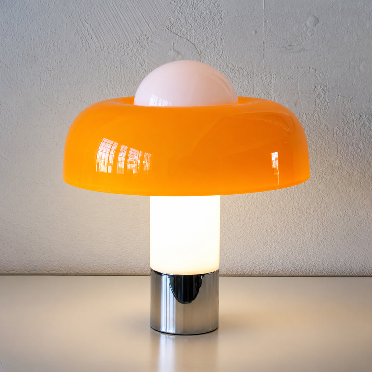 Giulia Table Lamp in Orange - Illuminated
