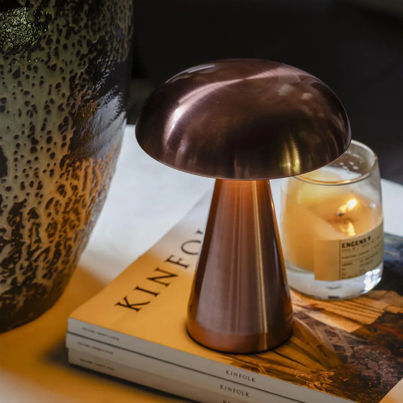 Copper mushroom lamp on Kinfolk magazine with candle, groovy funky lighting decor