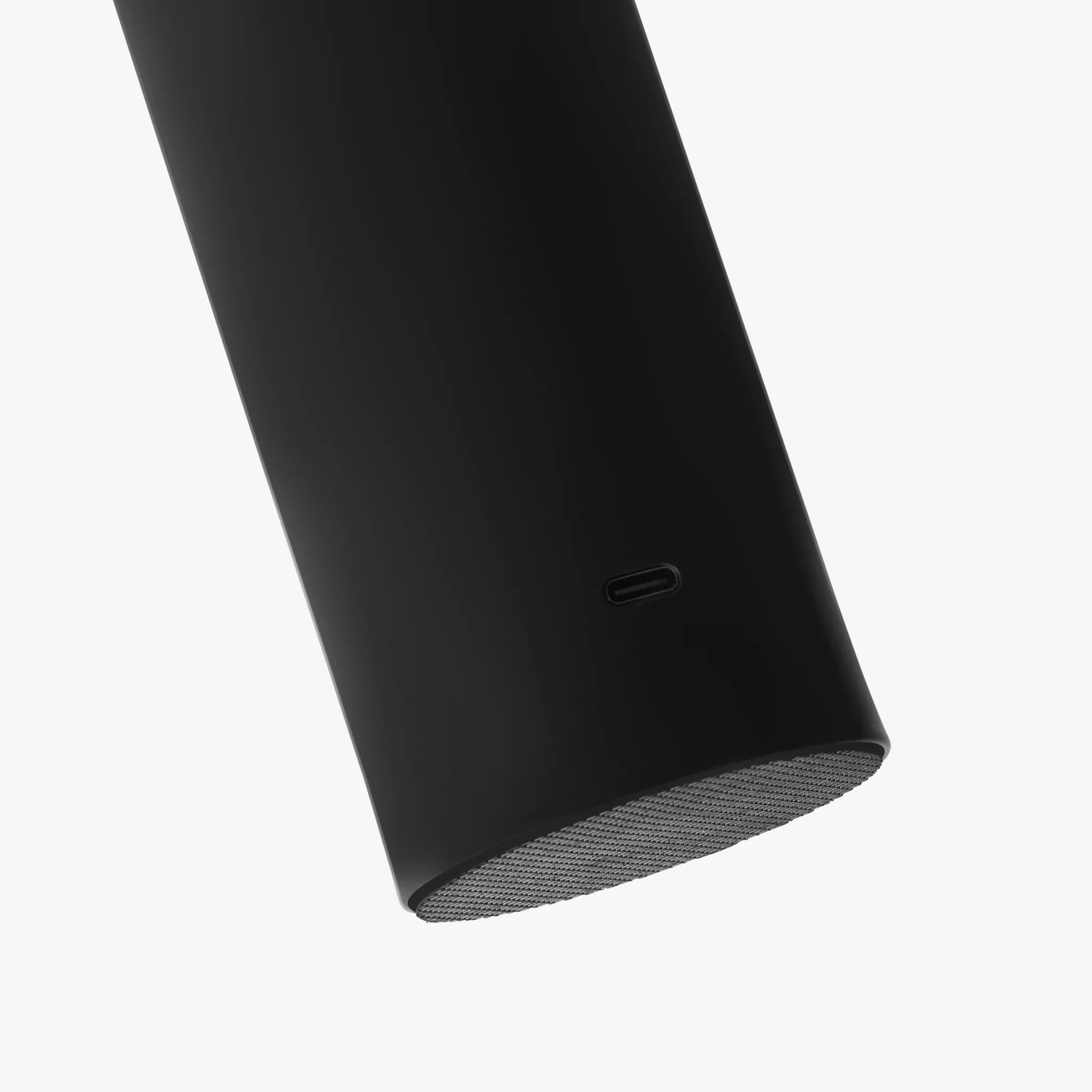 Sleek black cylindrical lamp base with USB-C port and textured grille, modern ambient lighting design