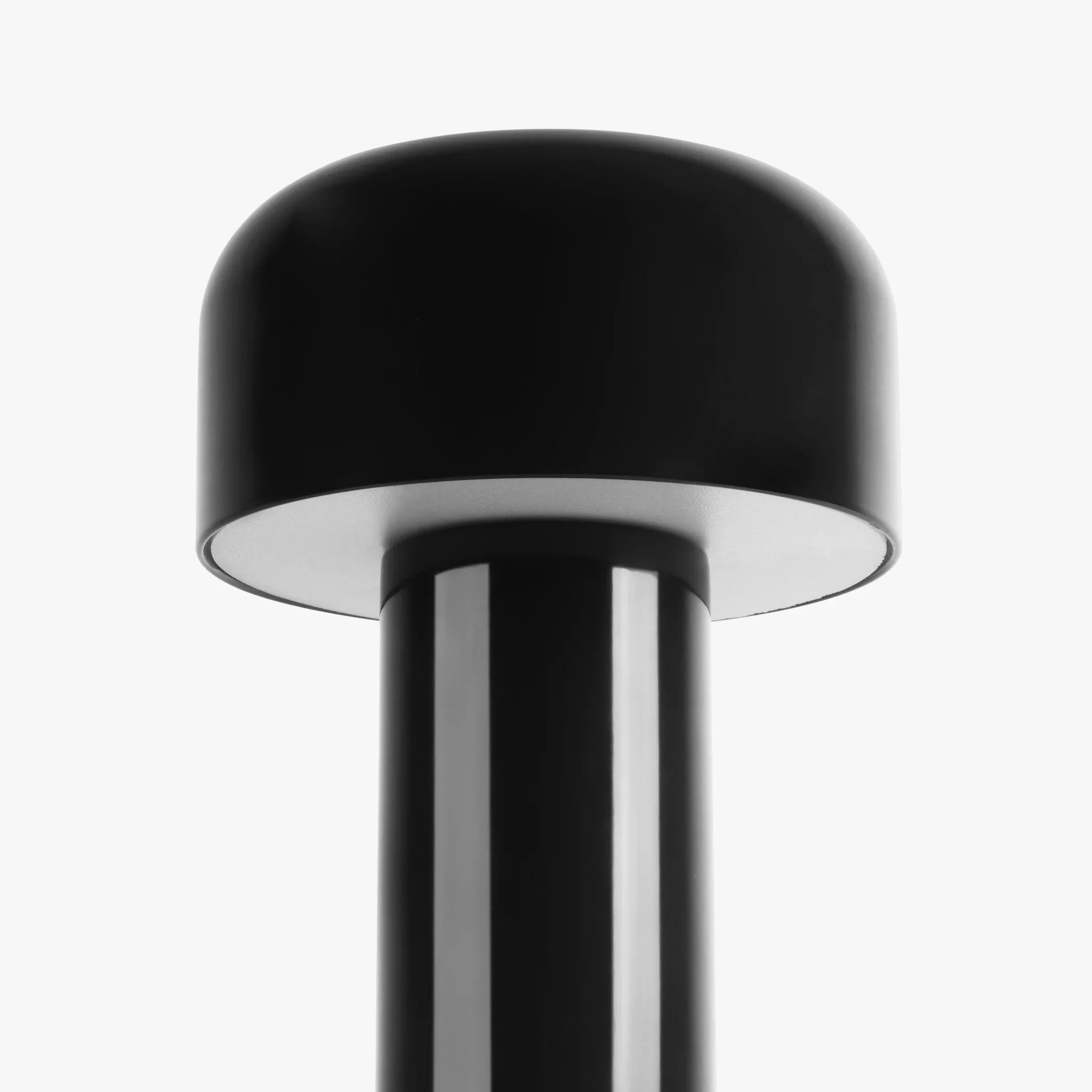 Sleek black modern lamp with dome shade and glossy finish, perfect for funky home decor