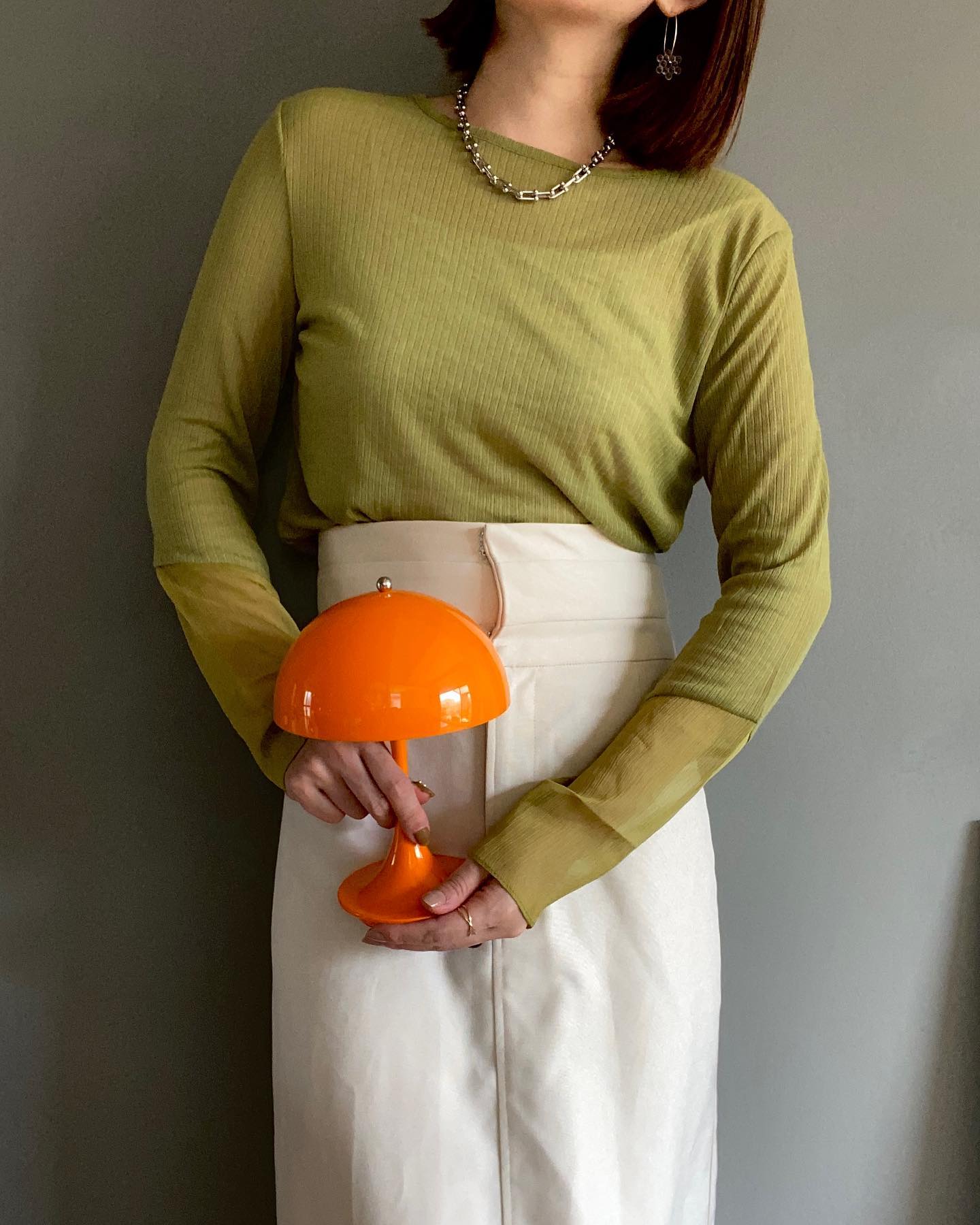 Estada Portable Lamp in Orange being held in hand